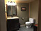 The Main Floor Bathroom has a antique copper sink and a shower/tub unit